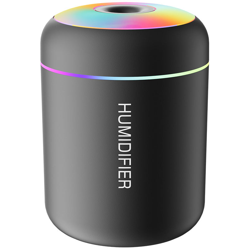 Black humidifier with colorful top on a white background