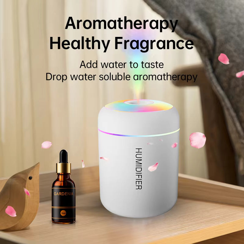 Humidifier with aromatherapy oil bottle on a wooden surface, featuring text about aromatherapy and healthy fragrance.